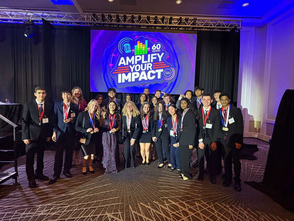 DECA team with medals at competition